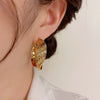 Exaggerated Twisted Metal Ear Loops